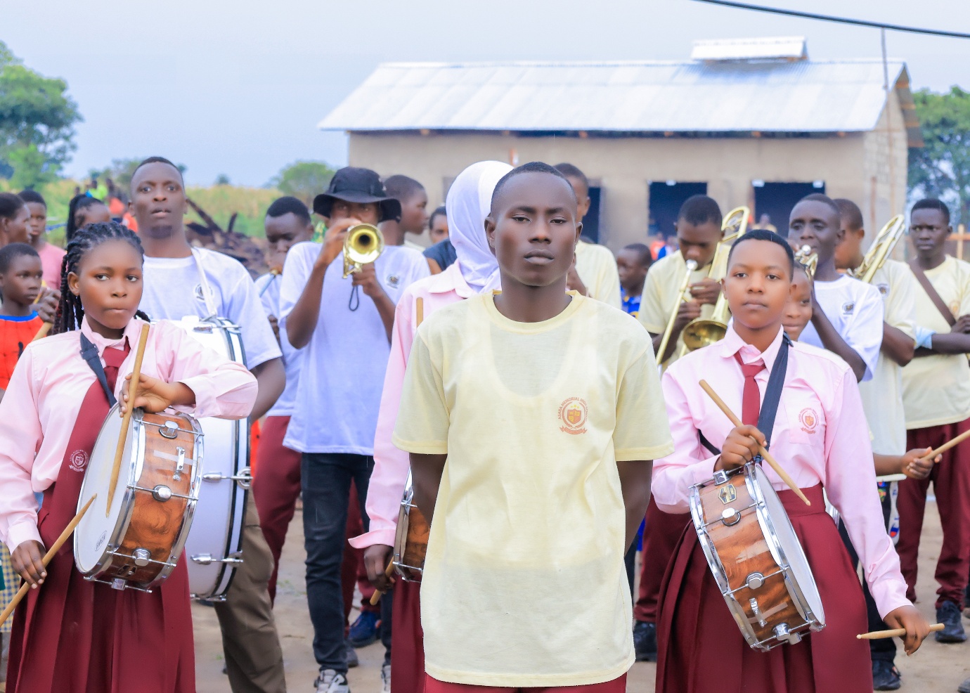 Asaba Memorial High School Brass Band Club students performing with drums and brass instruments
