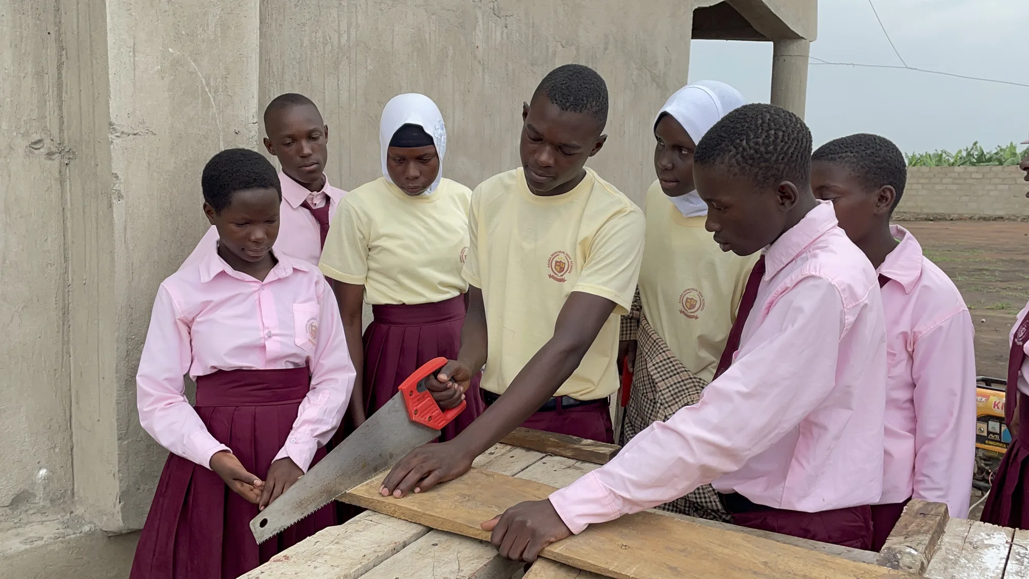 Asaba Memorial High School students learning practical carpentry skills together