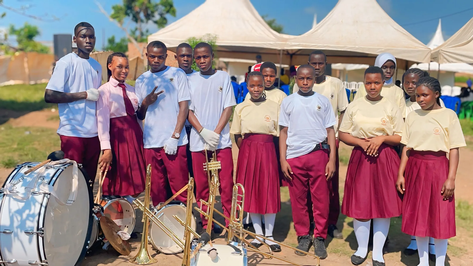 Asaba Memorial High School students gathered with brass band instruments
