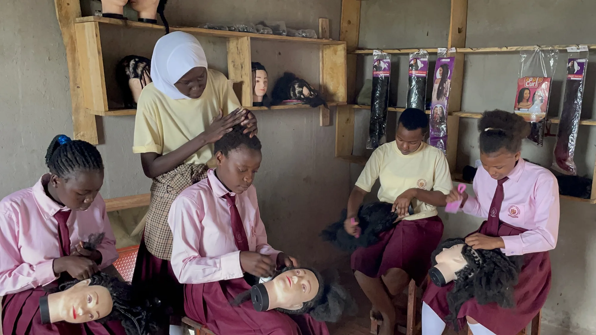 Students practising hairdressing techniques during vocational training