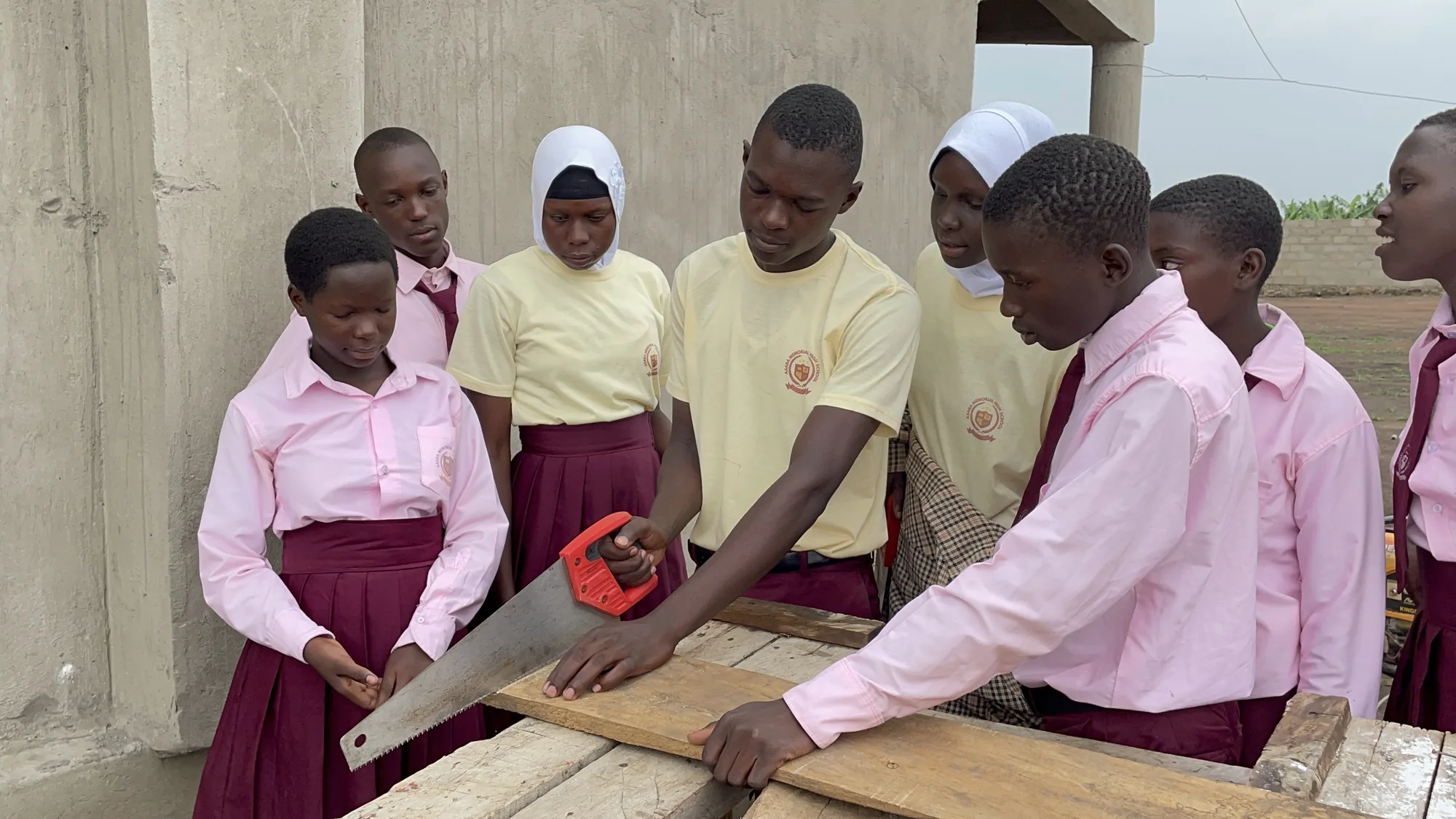 Students learning practical carpentry skills